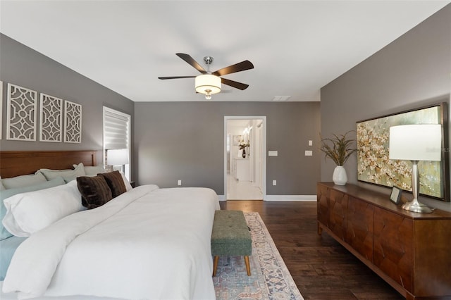 bedroom featuring visible vents, baseboards, ceiling fan, and dark wood-style flooring