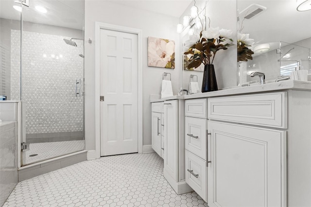 bathroom with vanity, a shower stall, and visible vents