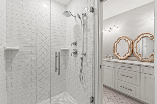 bathroom with a stall shower and vanity