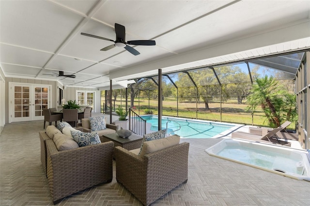 outdoor pool with glass enclosure, a patio, french doors, and an in ground hot tub