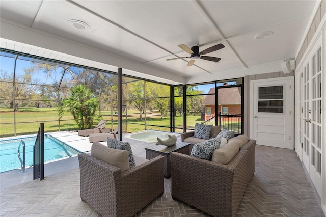 sunroom with a ceiling fan