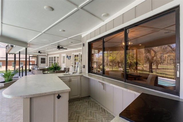 view of patio / terrace with a ceiling fan and outdoor dry bar