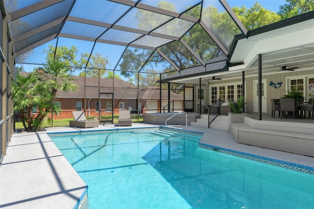 pool featuring french doors, a patio, a lanai, and a ceiling fan