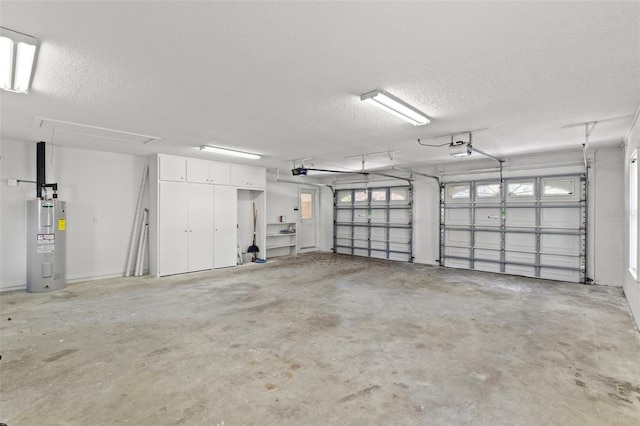 garage with water heater and a garage door opener