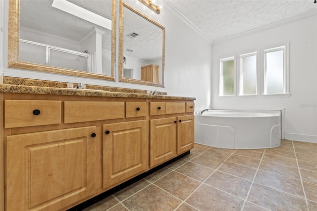 bathroom with double vanity, a textured ceiling, a shower stall, and crown molding