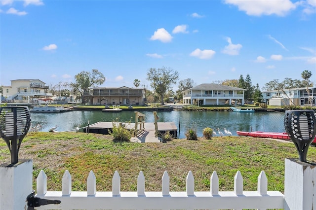 property view of water with a residential view and a dock