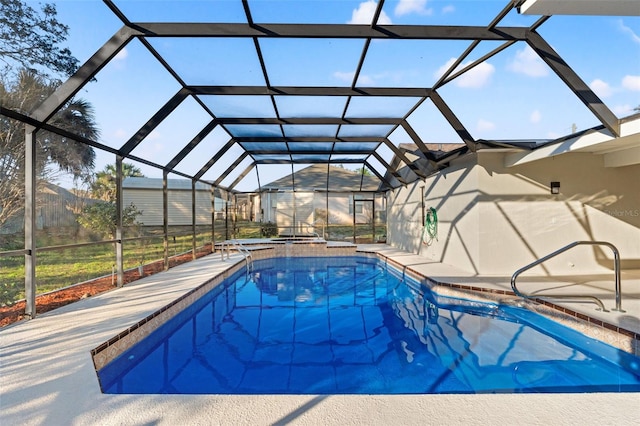 pool with a lanai and a patio