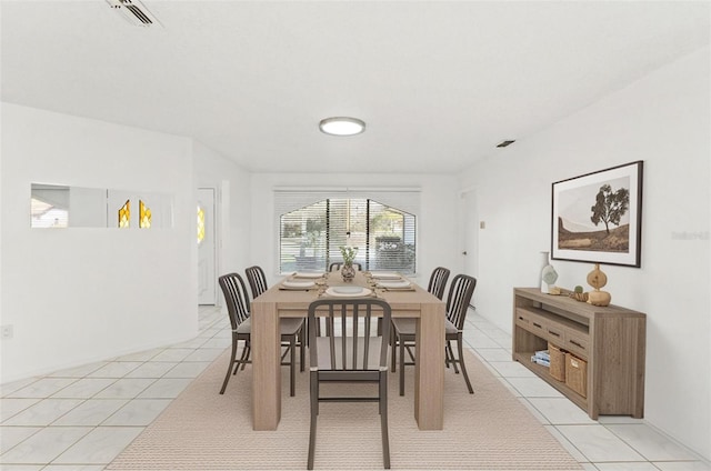 1011 Altoona Ave, Spring Hill, FL 34609 - dining area with light tile patterned floors