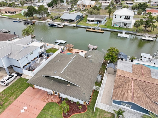 birds eye view of property with a residential view and a water view