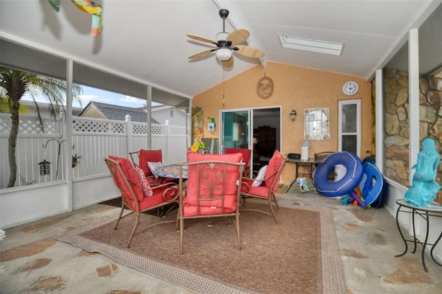 sunroom / solarium featuring vaulted ceiling and ceiling fan