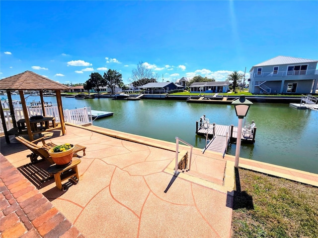 view of dock featuring a residential view and a water view