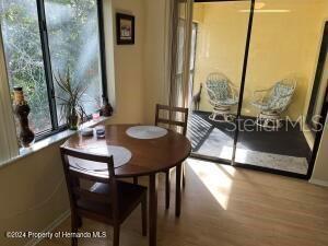 dining room with baseboards and wood finished floors