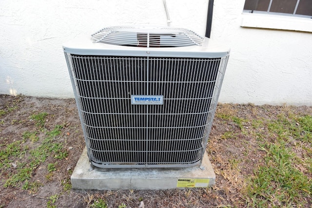 exterior details featuring central air condition unit and stucco siding