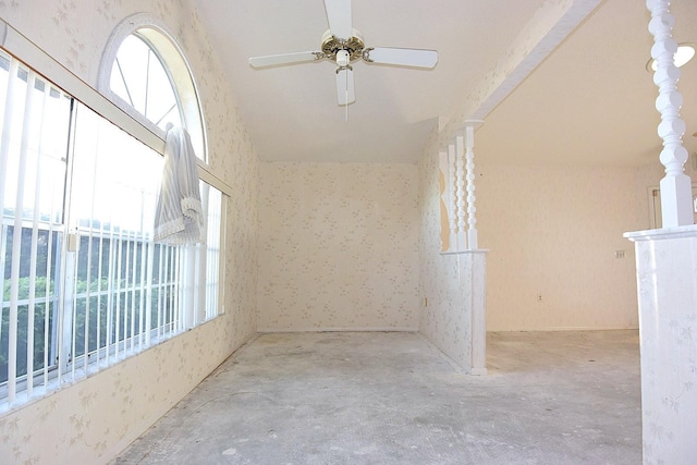 empty room featuring wallpapered walls, ceiling fan, and concrete floors