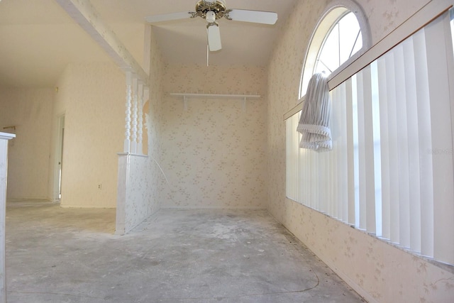 empty room featuring concrete floors and a ceiling fan