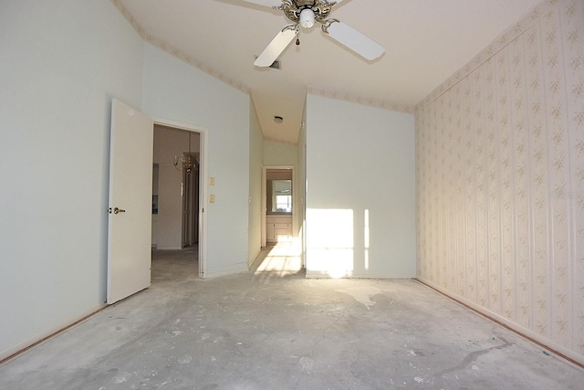 unfurnished room featuring ceiling fan, vaulted ceiling, unfinished concrete flooring, and wallpapered walls