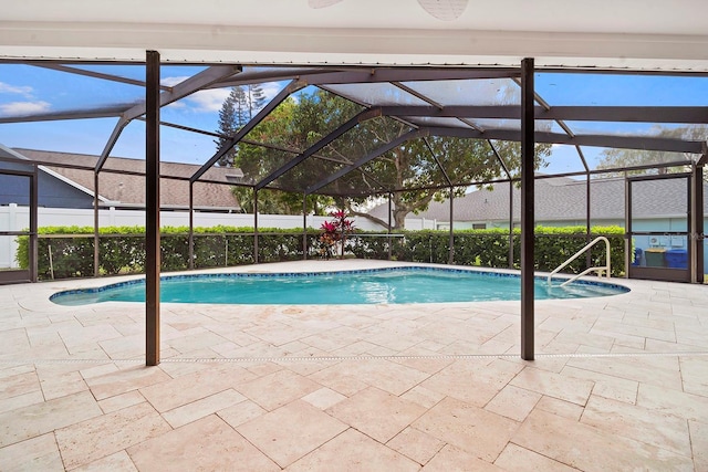 view of swimming pool featuring a fenced in pool, a lanai, and a patio