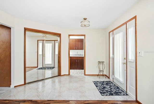 entrance foyer featuring baseboards