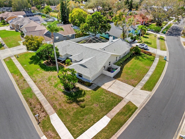 birds eye view of property with a residential view