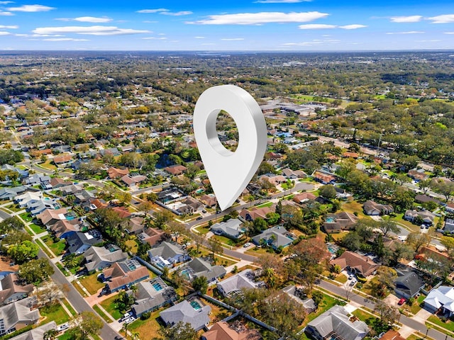 birds eye view of property with a residential view