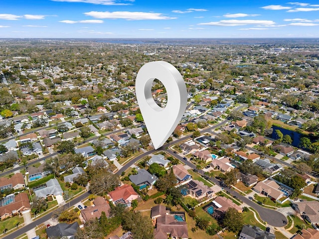 birds eye view of property with a residential view