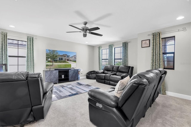 carpeted living room featuring ceiling fan, recessed lighting, and baseboards