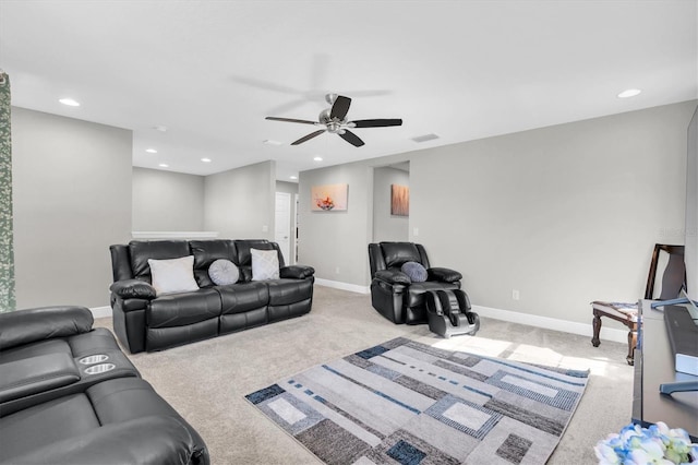 carpeted living room featuring visible vents, baseboards, and recessed lighting