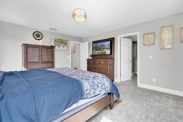 bedroom with baseboards, visible vents, and light colored carpet