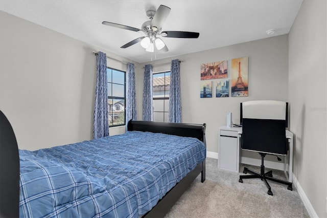 bedroom featuring carpet floors, baseboards, and a ceiling fan