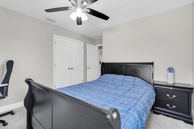 bedroom with a ceiling fan, baseboards, visible vents, and carpet flooring