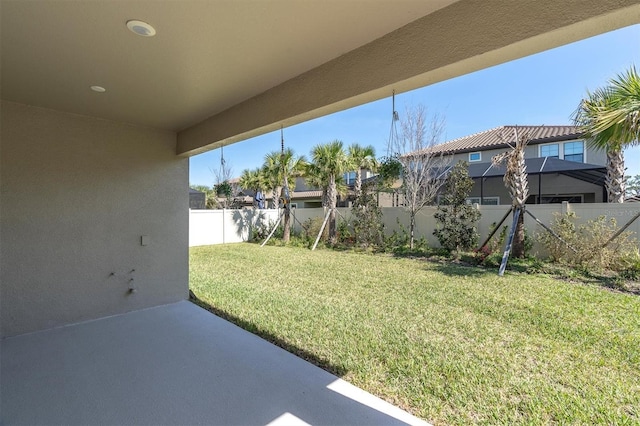 view of yard featuring a patio area and a fenced backyard