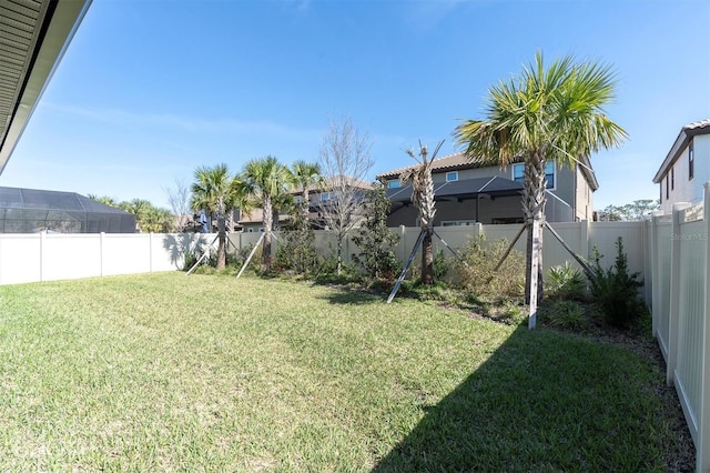 view of yard with a fenced backyard