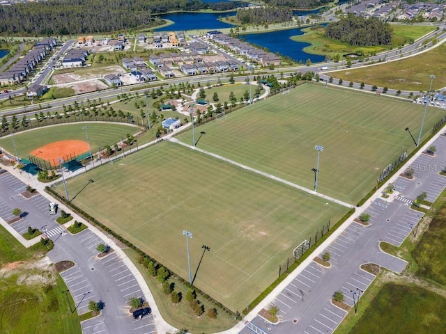 birds eye view of property with a water view