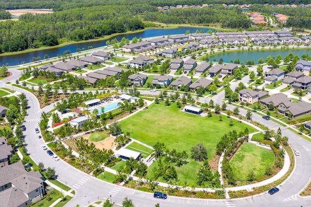 drone / aerial view featuring a water view and a residential view