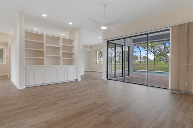 unfurnished room featuring light wood-style floors, recessed lighting, baseboards, and a ceiling fan