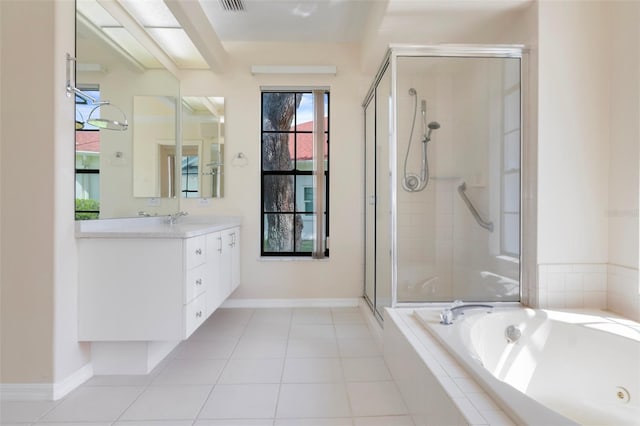 full bath with a stall shower, vanity, tile patterned flooring, a whirlpool tub, and baseboards