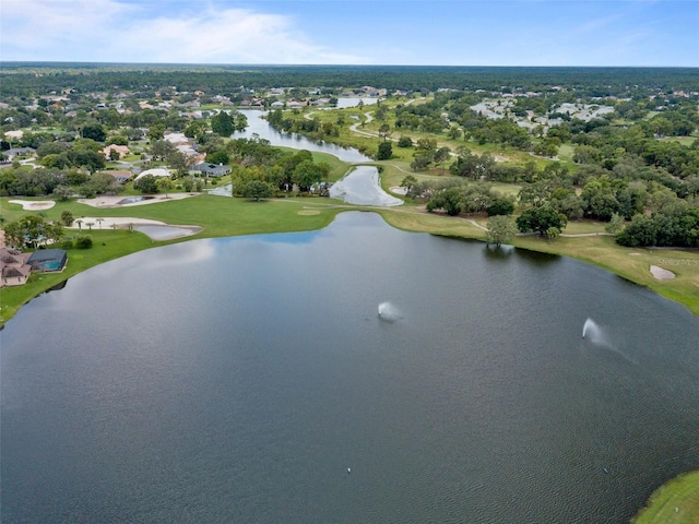 birds eye view of property featuring view of golf course and a water view