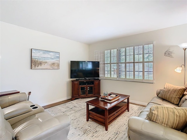 living room featuring light wood-style floors and baseboards