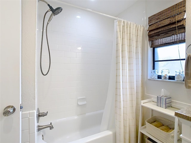 bathroom featuring shower / bath combo with shower curtain