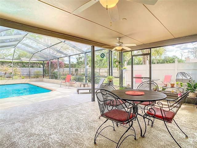 view of pool featuring a ceiling fan, a fenced in pool, a fenced backyard, a lanai, and a patio area