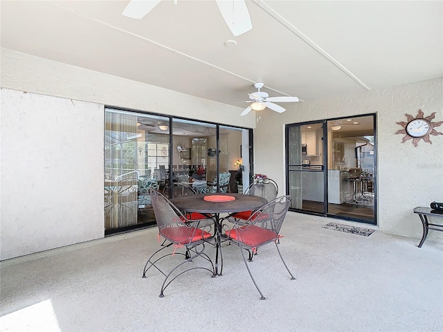 interior space with ceiling fan and outdoor dining area