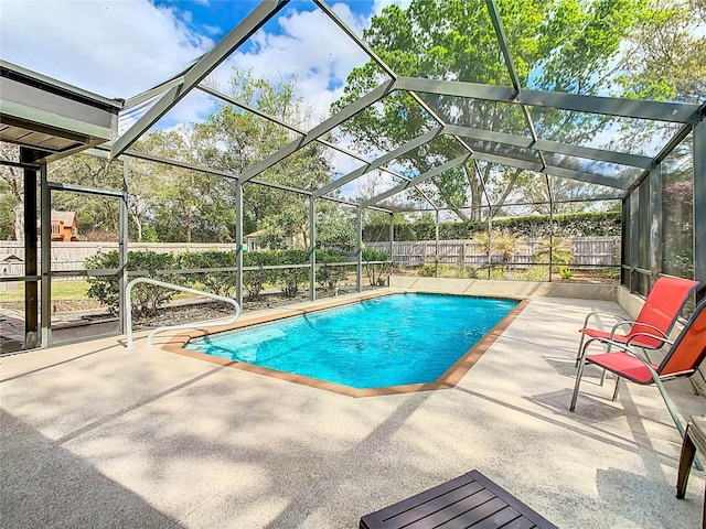 view of swimming pool with a fenced in pool, a fenced backyard, and a patio