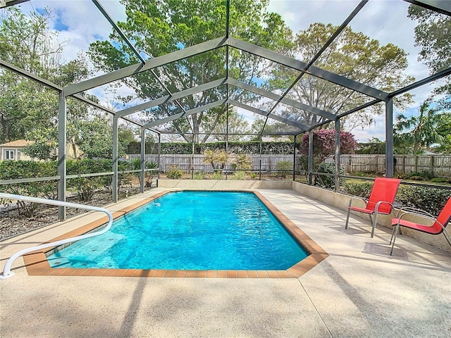 view of swimming pool with a lanai, a patio area, a fenced backyard, and a fenced in pool