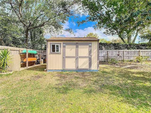 view of shed with a fenced backyard