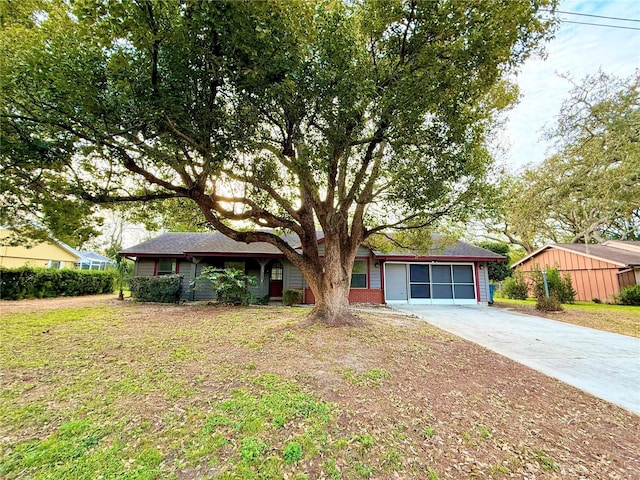 ranch-style home featuring a front yard and driveway