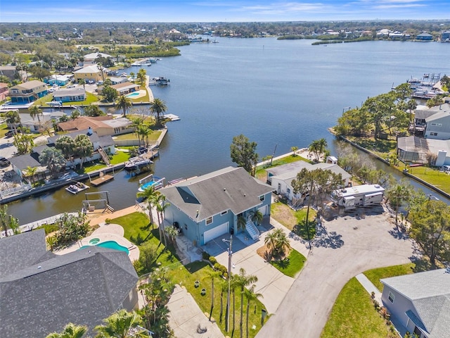 birds eye view of property featuring a water view and a residential view