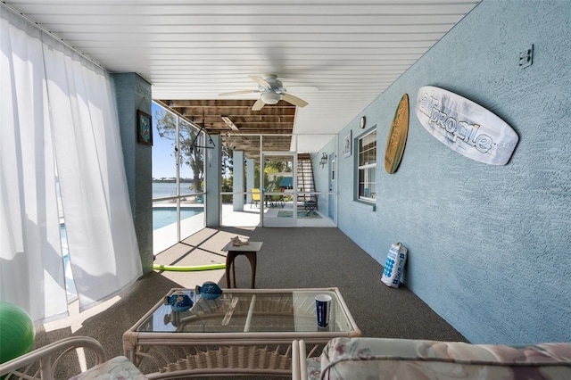 interior space featuring ceiling fan