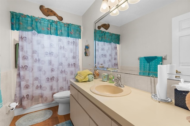 bathroom with vanity, toilet, and shower / bathtub combination with curtain