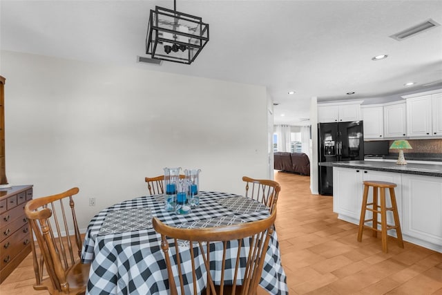 dining space featuring visible vents and recessed lighting