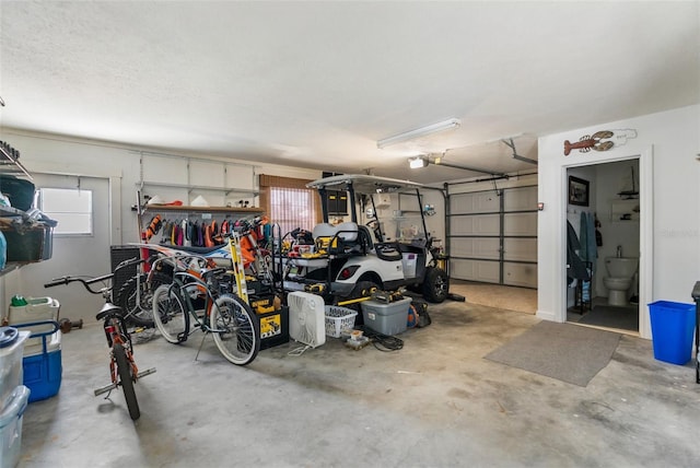 garage featuring bike storage and a garage door opener